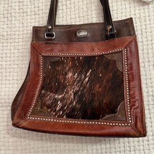 Vintage American West (tooled by hand) cow hide brown shoulder purse